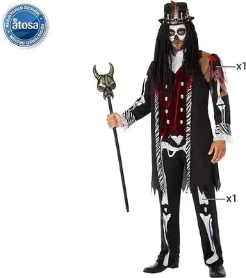 A man dressed in a voodoo costume holding a staff.