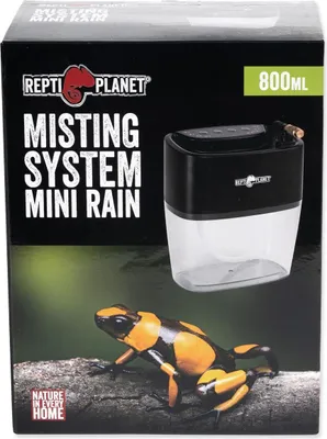 The image shows the packaging for a Repti Planet Misting System Mini Rain, featuring a frog on a branch.