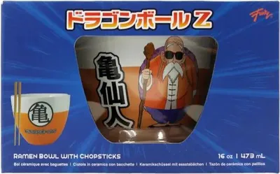 The image shows the packaging for a Dragon Ball Z ramen bowl with chopsticks. The packaging features a blue background with radiating lines, and a window revealing the ramen bowl and a depiction of Master Roshi.