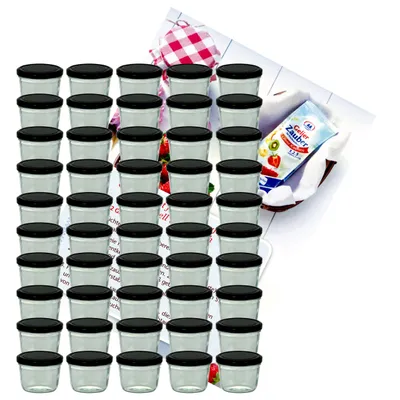 A collection of small glass jars with black lids, arranged in rows, with a small packet of what appears to be dessert mix in the background.