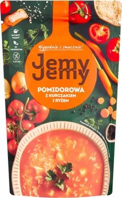 A pouch of tomato soup with chicken and rice, surrounded by fresh ingredients like tomatoes, onions, and carrots.