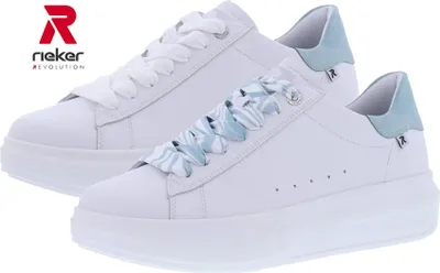 Two white Rieker sneakers with light blue accents and decorative laces are shown side-by-side against a white background.