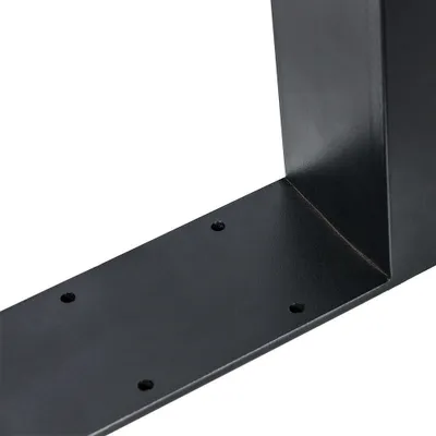 A close-up of a black metal table leg bracket with pre-drilled holes.