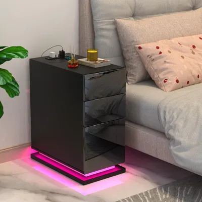 Immagine prodotto di Tavolino da notte con 3 cassetti, base di ricarica, luci LED e 2 prese di corrente/2 porte USB, design compatto, colore nero, dimensioni 30x50x63 cm