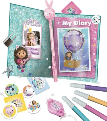 A collection of items related to a secret diary set, including a diary, markers, stickers, and a wand.