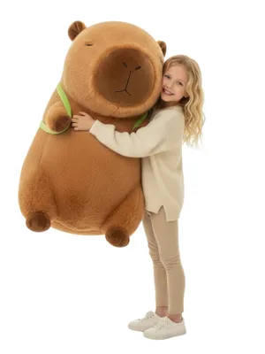 A young girl hugging a large plush capybara toy.