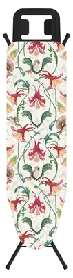 An ironing board cover with a floral and bird pattern.