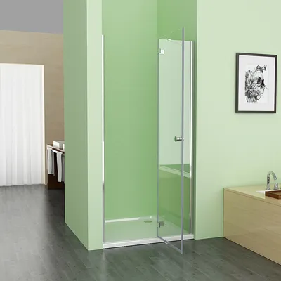 A modern bathroom with a glass shower enclosure, a vanity, and a framed picture on the wall.
