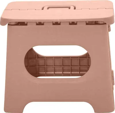 A pink foldable stool against a white background.