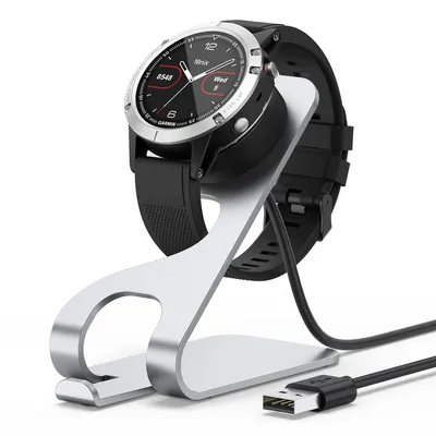 A smartwatch charging stand with a smartwatch on it, and a USB-C cable.