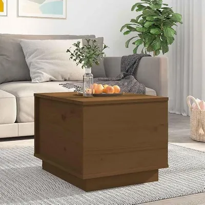 Imagen del producto de Mesa de centro en color miel, fabricada en madera maciza de pino, con tapa elevable y espacio de almacenamiento. Dimensiones: 40x50x35 cm. Material: madera maciza de pino
