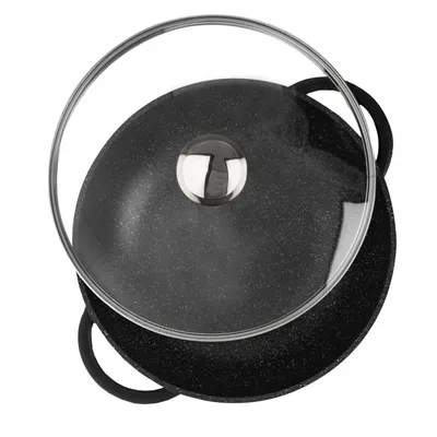 A top-down view of a black wok pan with a glass lid and a silver handle.