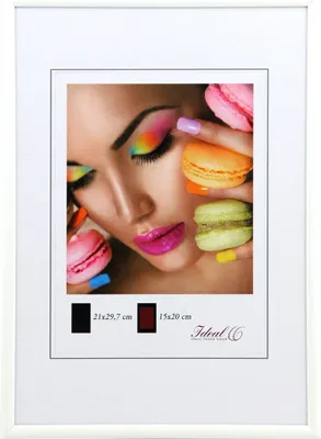 A close-up marketing image of a woman's face with colorful makeup and macarons, framed by a white mat and frame.