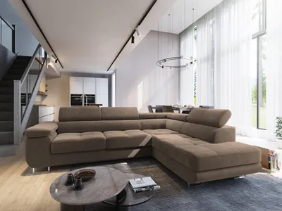 A modern living room with a large sectional sofa, dining area, and staircase.