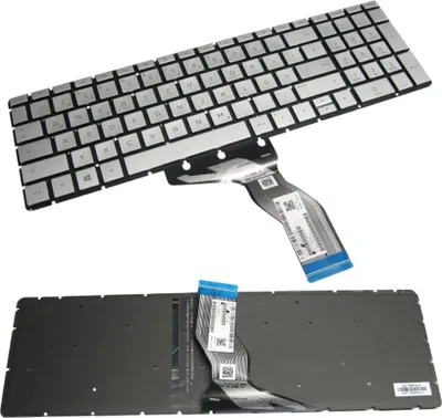 A laptop keyboard and its underside are shown against a white background.