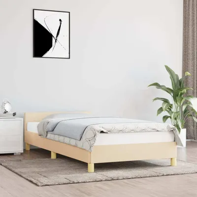 A bedroom scene with a bed, nightstand, and plant.
