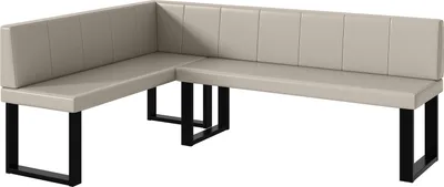 A corner bench with beige upholstery and black metal legs.