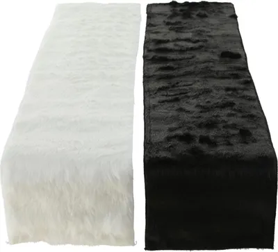 Two faux fur table runners, one white and one black, laid out side-by-side on a white background.