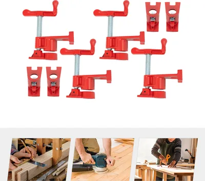 A set of red pipe clamps on a white background.