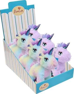 A display box filled with plush unicorn toys.