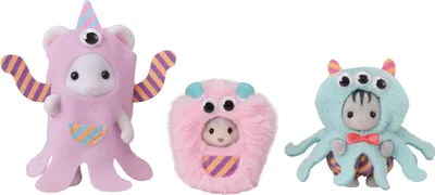 Three small, plush monster toys with animal-like faces, each wearing a different monster costume.
