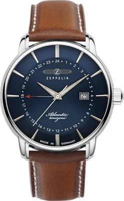 A close-up studio shot of a men's wristwatch with a blue dial and a brown leather strap.