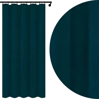 A dark blue curtain hanging from a rod, with a close-up view of the fabric texture.