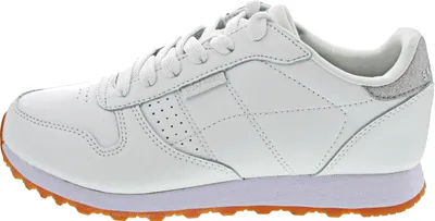 A side view of a white Skechers sports shoe.