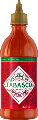 A bottle of Tabasco Sriracha Sauce against a white background.