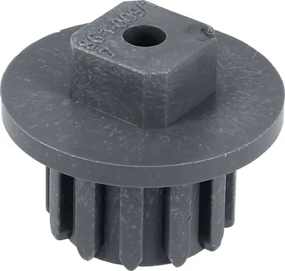 A close-up studio shot of a gray plastic gear.