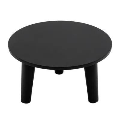 A black round plant stand with three legs on a white background.