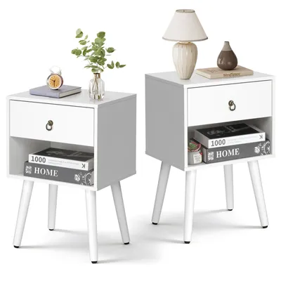 Two white nightstands with open shelves and drawers, displayed against a white background.