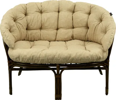 A close-up studio shot of a two-seater rattan sofa with beige cushions.