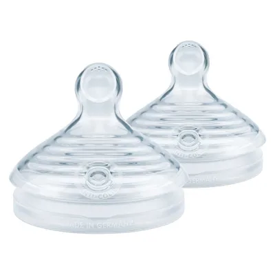 Two clear silicone baby bottle nipples on a white background.