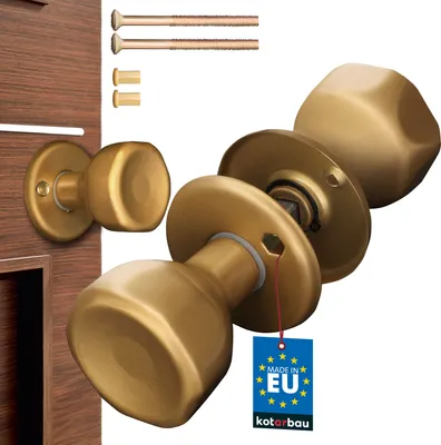 A set of gold-colored door knobs and mounting hardware, with a 'Made in EU' tag.