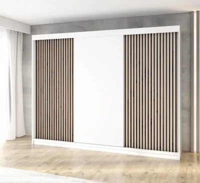 A modern wardrobe with sliding doors and slatted panels, set against a concrete wall and wooden floor.