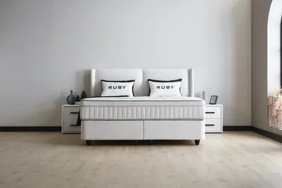 Produktbild von Boxspringbett Ruby 180 x 200 cm mit 2 Nachtkonsolen Cremeweiß Voll-orthopädisches Komfortbett mit Bettkasten, Stauraum, inkl. Lieferung und Montage