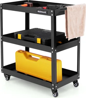 A black three-tier tool cart with various tools and cases on it, including a hammer, a black toolbox, and a yellow case.