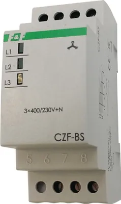 A close-up, angled view of a white electrical component with green accents, mounted on a DIN rail.