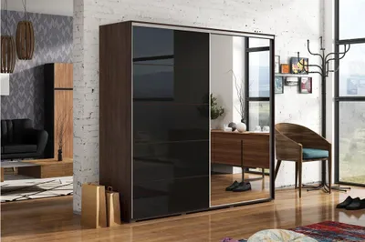 A modern bedroom or dressing room with a large wardrobe, a chair, and a coat rack.