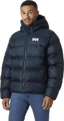 A man wearing a blue puffer jacket and jeans, posing for a product shot.