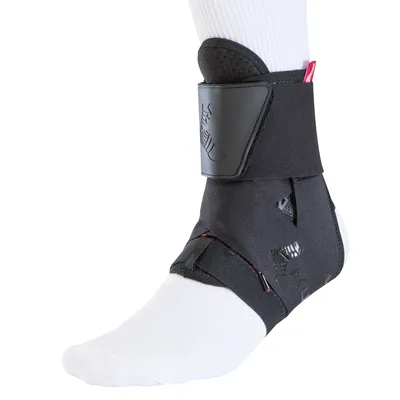 A black ankle brace is shown on a white socked foot, isolated on a white background.