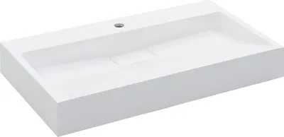 A white rectangular washbasin with a drain hole in the center.