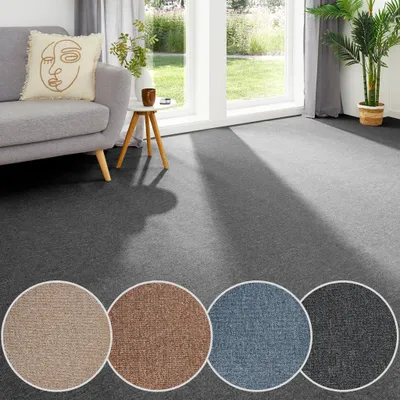 Teppichboden als Auslegware in anthrazit mit Farbmustern in beige, cognac, blau. 
