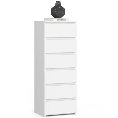 A white chest of drawers with a decorative vase on top.