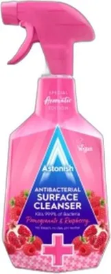 A pink spray bottle of Astonish antibacterial surface cleanser with pomegranate and raspberry scent.