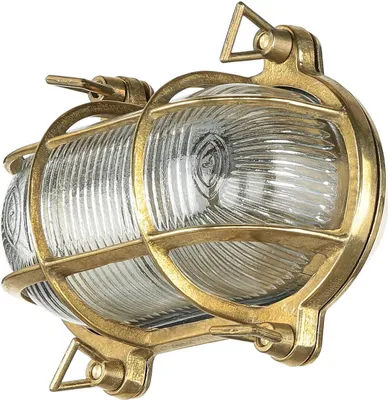 A brass and glass outdoor wall light.