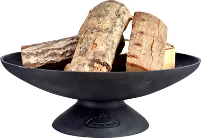 A black cast iron fire bowl filled with logs, presented on a white background.