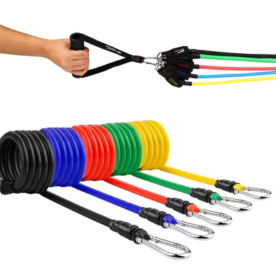 A hand holding a resistance band handle with multiple bands attached, and a coiled set of resistance bands in various colors.