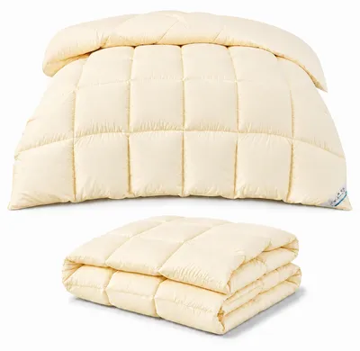 Image de Couette moelleuse avec rembourrage en fibres, adaptée à toutes les saisons